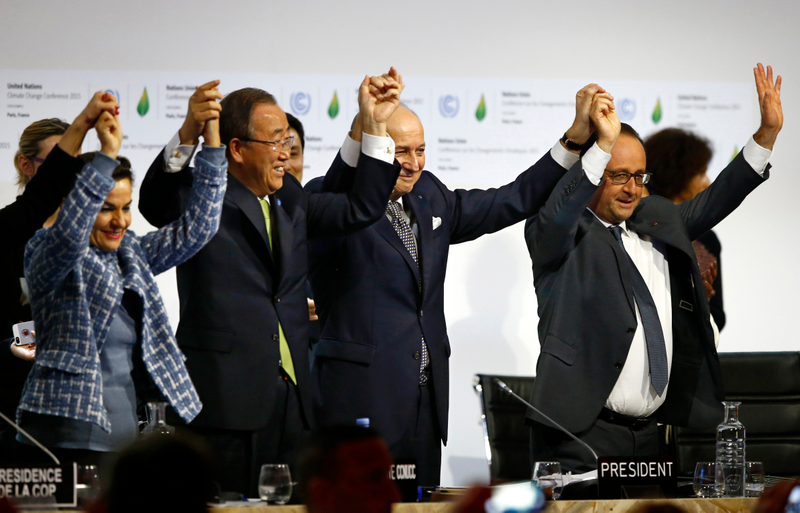 In this Dec. 2015 photo, French President Francois Hollande, right, French Foreign Minister and president of the COP21 Laurent Fabius, second right, United Nations climate chief Christiana Figueres, left, and United Nations Secretary General Ban Ki-moon hold their hands up in celebration after the final conference at the COP21, the United Nations conference on climate change, in Le Bourget, north of Paris. AP